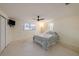 Spacious bedroom with a ceiling fan, ample natural light, and closet space at 5346 Quist Dr, Port Richey, FL 34668