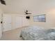 Comfortable bedroom with closet, ceiling fan, and plenty of natural light at 5346 Quist Dr, Port Richey, FL 34668