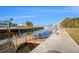 Waterfront view of the dock with canal access and boat lift at 5346 Quist Dr, Port Richey, FL 34668