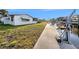 Waterfront home featuring private dock with boat lift, a unique property amenity on a sunny day at 5346 Quist Dr, Port Richey, FL 34668