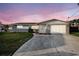 Charming single-story home featuring a stone accent garage and driveway at 5346 Quist Dr, Port Richey, FL 34668