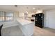 Contemporary kitchen featuring white cabinets, quartz countertops, stainless steel appliances, and breakfast bar at 5346 Quist Dr, Port Richey, FL 34668