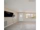 Bright living room with tile flooring, a front door, and neutral paint at 5346 Quist Dr, Port Richey, FL 34668