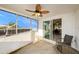 Enclosed patio with water views, a ceiling fan, and access to indoor dining at 5346 Quist Dr, Port Richey, FL 34668