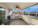 Enclosed patio with a ceiling fan overlooks the canal and the outdoors at 5346 Quist Dr, Port Richey, FL 34668