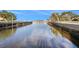 Canal waterfront view with clear water and houses on the sides at 5346 Quist Dr, Port Richey, FL 34668