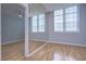 Bedroom with hardwood floors and mirrored wall at 701 Mirror Lake N Dr # 309, St Petersburg, FL 33701