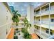 Elevated view of a building's courtyard with lush landscaping at 701 Mirror Lake N Dr # 309, St Petersburg, FL 33701