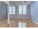 Large bedroom with hardwood floors and mirrored wall at 701 Mirror Lake N Dr # 309, St Petersburg, FL 33701