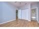 Bedroom with hardwood floors and built-in closet at 701 Mirror Lake N Dr # 309, St Petersburg, FL 33701