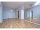 Spacious living area with hardwood floors and large mirror at 701 Mirror Lake N Dr # 309, St Petersburg, FL 33701