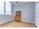 Bedroom with hardwood floors and vintage cabinet at 701 Mirror Lake N Dr # 309, St Petersburg, FL 33701