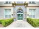 Ornate building entrance with detailed stonework and landscaping at 701 Mirror Lake N Dr # 309, St Petersburg, FL 33701
