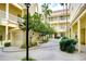 Peaceful courtyard with lush landscaping and seating areas at 701 Mirror Lake N Dr # 309, St Petersburg, FL 33701