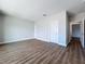 Large bedroom with wood-look floors and access to other rooms at 7654 93Rd N St, Seminole, FL 33777