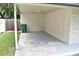 Covered carport area next to the house at 11003 N 27Th St, Tampa, FL 33612