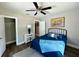 Cozy bedroom with a double bed, modern decor, and an adjacent closet at 1554 Elmwood St, Clearwater, FL 33755