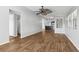 Open concept living room and kitchen with hardwood floors at 3121 Briar St, Wesley Chapel, FL 33543