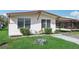 Single story home with covered carport and landscaping at 3121 Briar St, Wesley Chapel, FL 33543