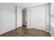 Bedroom with double door closet and wood floors at 3121 Briar St, Wesley Chapel, FL 33543