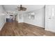 Bright living room features wood-look floors and a ceiling fan at 3121 Briar St, Wesley Chapel, FL 33543