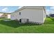 Exterior view of a single wide mobile home with a storage shed at 3121 Briar St, Wesley Chapel, FL 33543