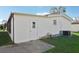 Exterior view of a single wide mobile home with a storage shed at 3121 Briar St, Wesley Chapel, FL 33543