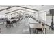 Spacious community hall with various tables and chairs at 3121 Briar St, Wesley Chapel, FL 33543