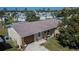 House with a brown roof and a well-maintained yard in a residential area at 10801 Fillmore Ave, Port Richey, FL 34668