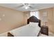 Bright bedroom with a comfortable bed and ceiling fan at 10801 Fillmore Ave, Port Richey, FL 34668