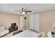 Bright bedroom with double closets and ceiling fan at 10801 Fillmore Ave, Port Richey, FL 34668