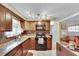 Bright kitchen with granite countertops and modern appliances at 10801 Fillmore Ave, Port Richey, FL 34668