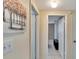 Clean hallway with neutral walls and simple decor at 10801 Fillmore Ave, Port Richey, FL 34668