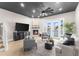 Spacious living room with a fireplace, water views, and ample natural light at 120 Brightwater Dr # 2, Clearwater Beach, FL 33767