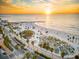 Aerial view of beautiful beach with palm trees and sunset at 120 Brightwater Dr # 2, Clearwater Beach, FL 33767