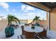 Spacious balcony with outdoor furniture and water view at 120 Brightwater Dr # 2, Clearwater Beach, FL 33767