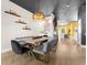 Elegant dining room featuring a long concrete table and gray seating at 120 Brightwater Dr # 2, Clearwater Beach, FL 33767