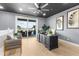 Spacious home office with a large desk and access to balcony at 120 Brightwater Dr # 2, Clearwater Beach, FL 33767