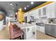 Modern kitchen with white cabinets, stainless steel appliances, and a large island at 120 Brightwater Dr # 2, Clearwater Beach, FL 33767
