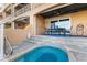 Outdoor patio with seating area and a view of the water at 120 Brightwater Dr # 2, Clearwater Beach, FL 33767