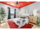 Bright bedroom with red accent wall and comfortable bedding at 120 Brightwater Dr # 2, Clearwater Beach, FL 33767