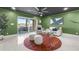 Open living room with water views and access to a patio at 120 Brightwater Dr # 2, Clearwater Beach, FL 33767