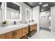 Modern bathroom with double vanity and large walk-in shower at 120 Brightwater Dr # 2, Clearwater Beach, FL 33767