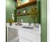 Small wet bar with white cabinets and a quartz countertop at 120 Brightwater Dr # 2, Clearwater Beach, FL 33767