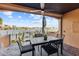 Outdoor patio with water views and seating for dining at 120 Brightwater Dr # 2, Clearwater Beach, FL 33767