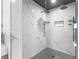 Spa-like shower with marble tile and rainfall shower head at 120 Brightwater Dr # 2, Clearwater Beach, FL 33767