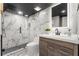 Modern bathroom with marble shower, vanity, and toilet at 120 Brightwater Dr # 2, Clearwater Beach, FL 33767