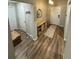 Inviting entryway with wood-look flooring and ample storage at 12730 Mangrove Forest Dr, Riverview, FL 33579