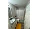 Clean bathroom with shower/tub combo, vanity, and updated flooring at 12730 Mangrove Forest Dr, Riverview, FL 33579
