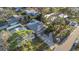 An aerial view showcasing the home's roof, driveway, and surrounding green landscape at 1786 Nevada Ne Ave, St Petersburg, FL 33703